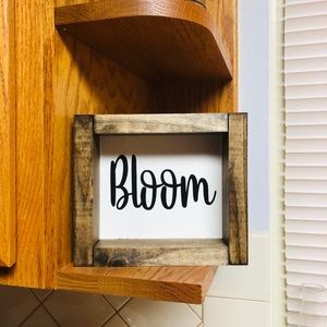 Wooden framed “bloom” sign